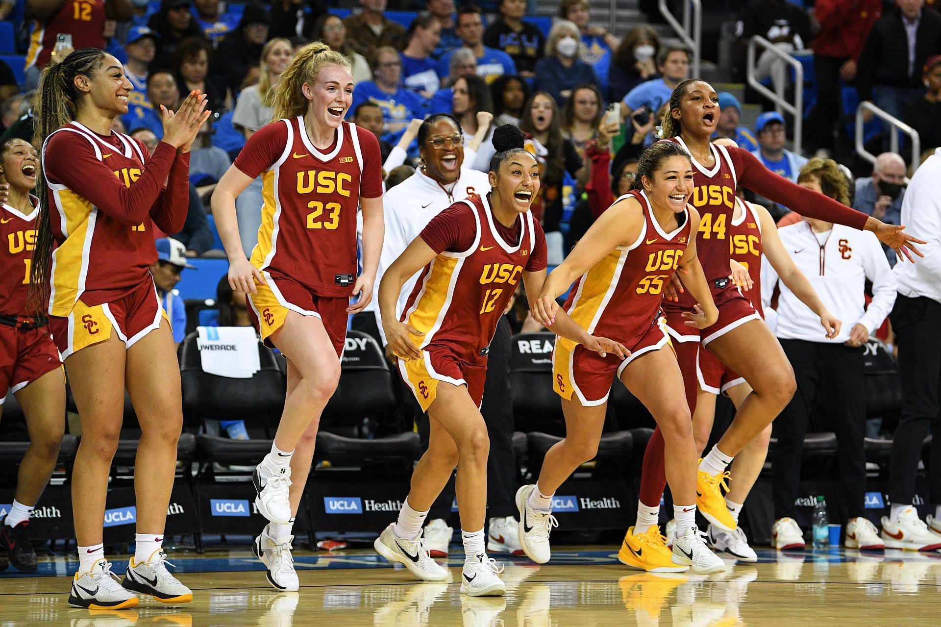 USC Trojans players Kennedy Smith (#11), Avery Howell (#23), JuJu Watkins (#12), Talia von Oelhoffen (#55) and Kiki Iriafen (#44) celebrate after beating the UCLA Bruins on March 1, 2025, at Pauley Pavilion. Photo: Getty